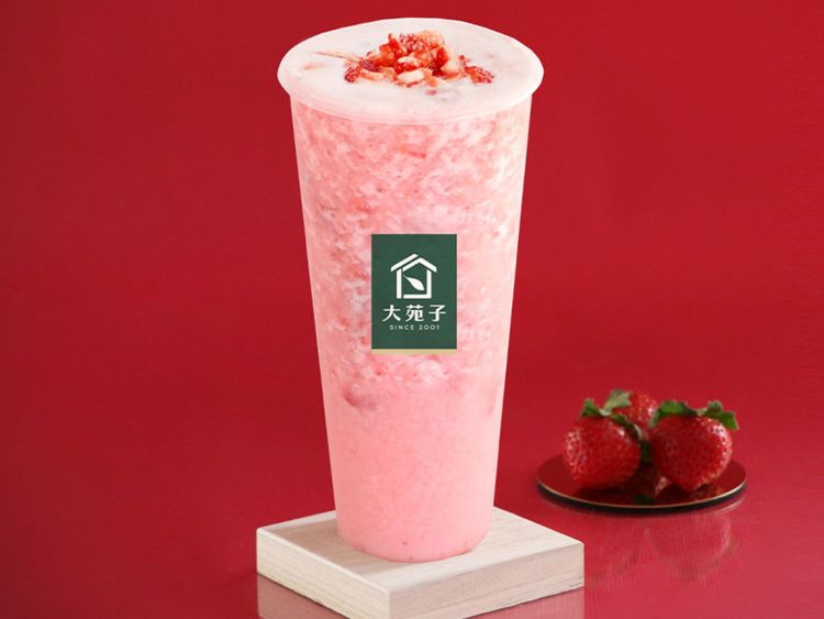 Pink Strawberry Fresh Milk topped with strawberry pieces