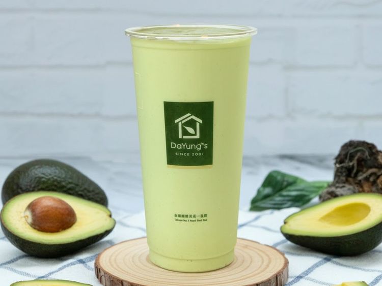 Light green Avocado Pudding Fresh Milk with avocado halves